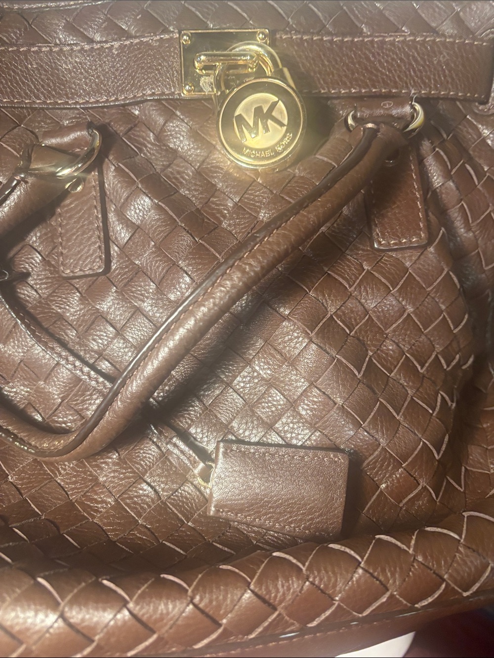 Michael Kors brown leather woven purse with lock and key